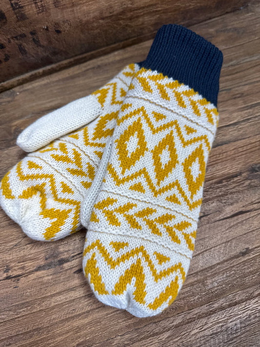 Navy knit mittens with white base and mustard yellow zigzag pattern