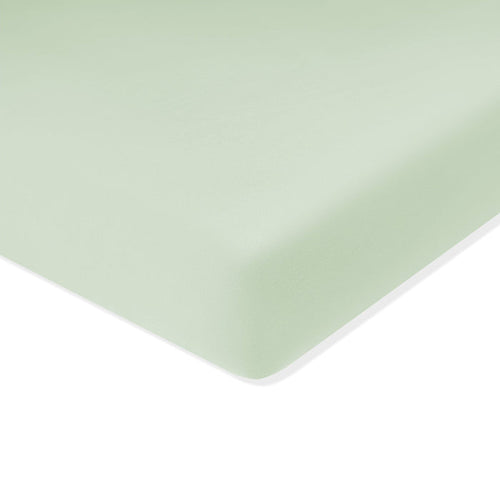Corner of the Crib Sheet in Basil shown on a crib mattress