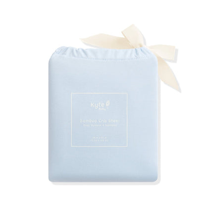Crib Sheet in Breeze shown in its packaging