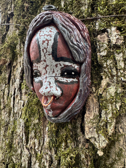 Bringing charm and vivacity, this mask will surely be a cherished adornment. Its tribal designs add pizzazz and make any room sparkle! It measures 4" x 3" x 2" and weighs approx. 6 ozs.
