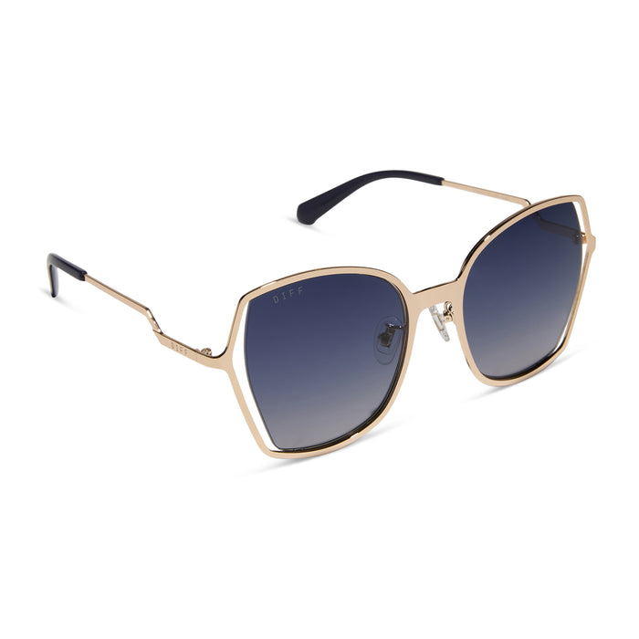 diff eyewear featuring the donna iii square sunglasses with a gold frame and midnight blue gradient polarized lenses angled view