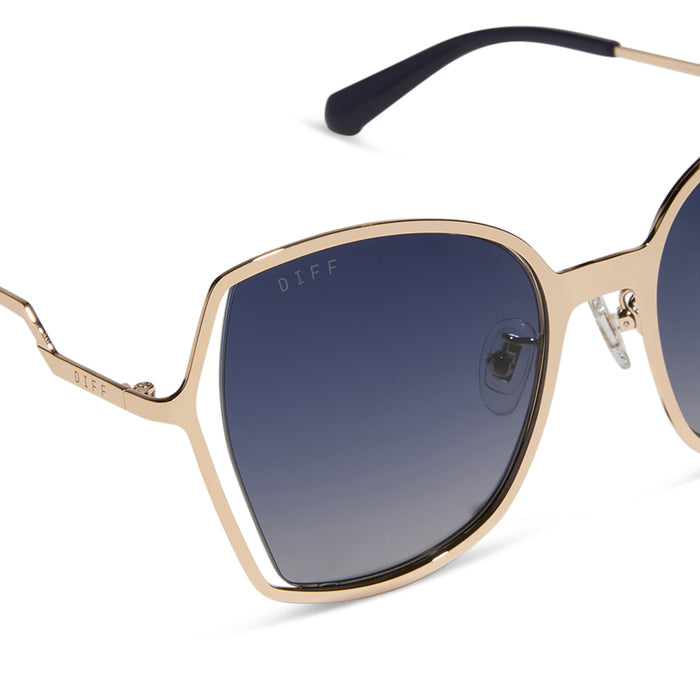 diff eyewear featuring the donna iii square sunglasses with a gold frame and midnight blue gradient polarized lenses detailed view