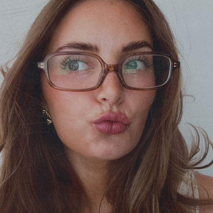on model - aspyn ovard female wearing aspyn ovard x diff eyewear featuring the elle rectangle prescription glasses with a tortoise frame front view