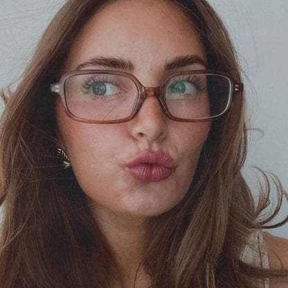 on model - aspyn ovard female wearing aspyn ovard x diff eyewear featuring the elle rectangle prescription glasses with a tortoise frame front view