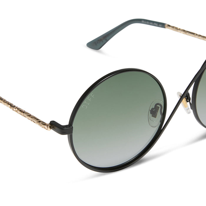 wicked x diff eyewear featuring the elphaba wire frames round sunglasses with a black frame and green lenses detailed view
