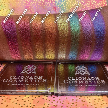 Straight angled arm swatches on deep skin tone of Embroidery Hybrid Multichrome Eyeshadow featured in Hybrid Mutlichrome Eyeshadow Bundle with Medieval, Rose Line, Mosaic, Heiress, Chalice, Shard, Tapestry