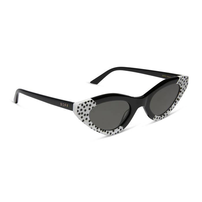 emily in paris x diff eyewear featuring the emily 2.0 cat eye sunglasses with a midnight polka dot frame and chic grey lenses angled view