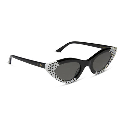 emily in paris x diff eyewear featuring the emily 2.0 cat eye sunglasses with a midnight polka dot frame and chic grey lenses angled view