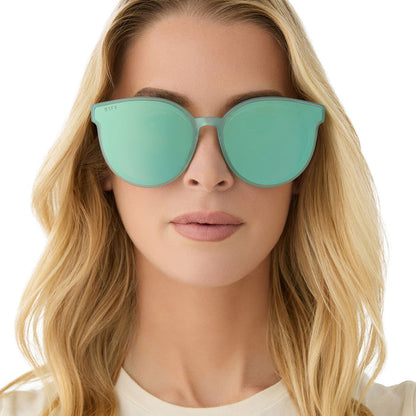 on model - female wearing diff eyewear featuring the gemma round sunglasses with a aquatic awe teal frame and aquatic awe teal mirror lenses front view