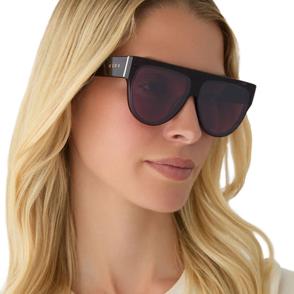 on model - female wearing diff eyewear featuring the georgie square sunglasses with a aubergine frame and aubergine with silver flash angled view