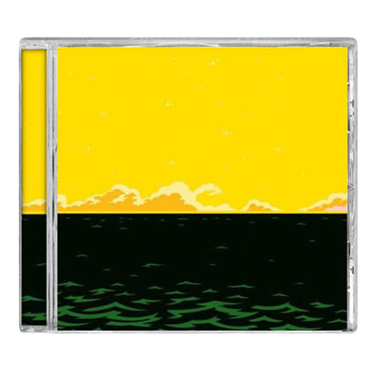 The Rocking Horse Winner CD case features artwork of a bright yellow sky with orange clouds above a dark green sea and light green waves—ideal for indie pop fans and those who love female-fronted bands.