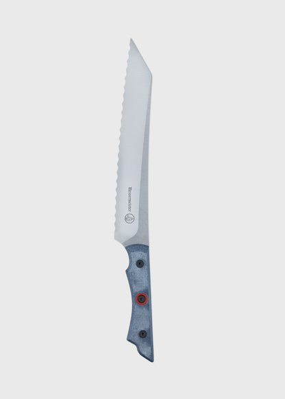 Serrated knife with a sleek, silver blade and a blue handle, featuring red accents, on a plain white background.