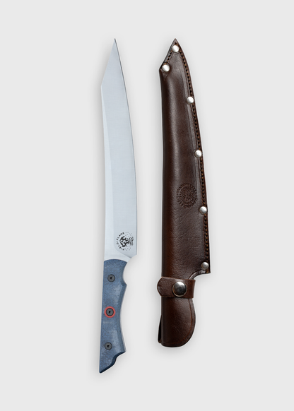 A sleek knife with a blue handle and a sharp blade beside a brown leather sheath, adorned with metal rivets, on a white background.