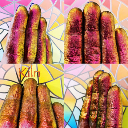 Finger swatches of Kiln Jewelled Multichrome Eyeshadow angle shifts red-orange-gold