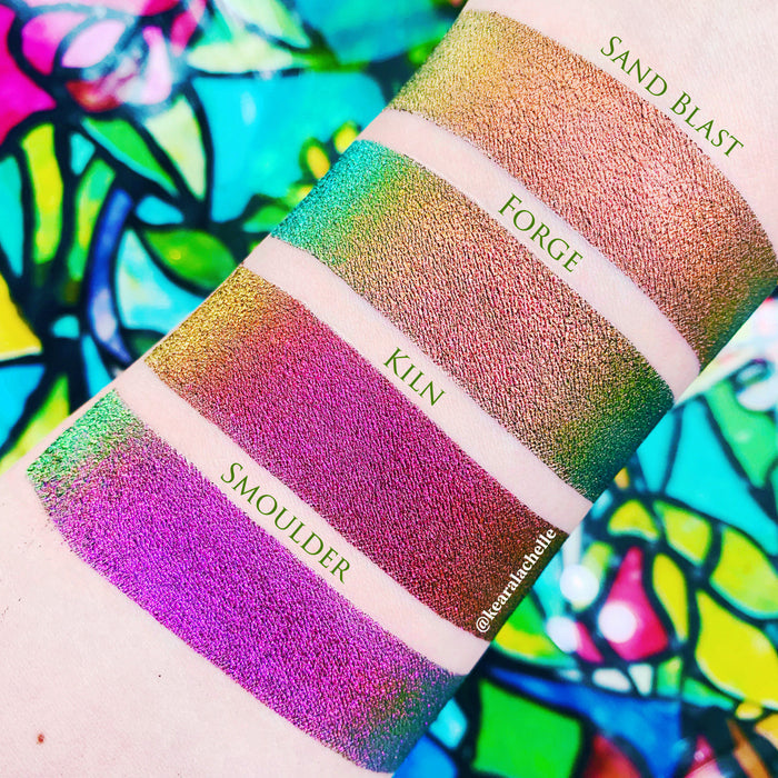 Top angled arm swatches on fair skin tone of Kiln Jewelled Multichrome Eyeshadow shifts compared to Sand Blast, Forge, Smoulder