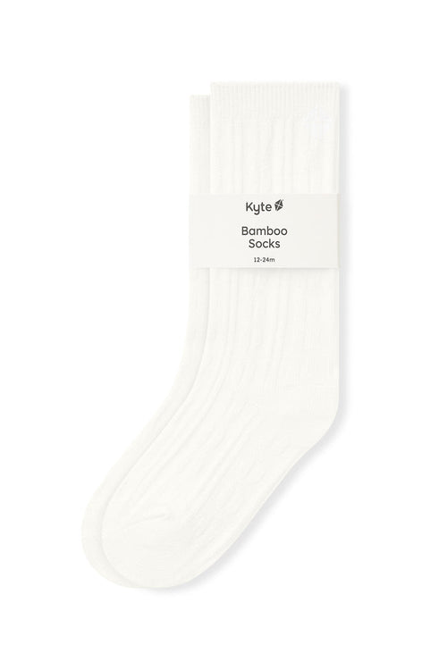 Knee high socks in cloud laying flat on a white background.
