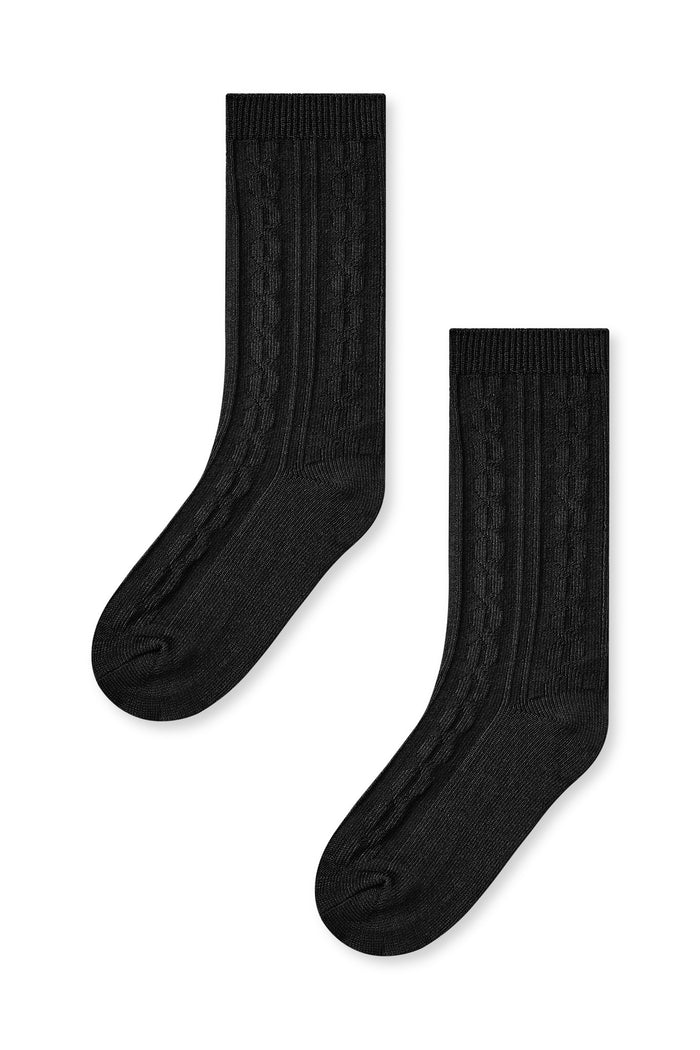 Knee high socks in midnight laying flat on a white background.