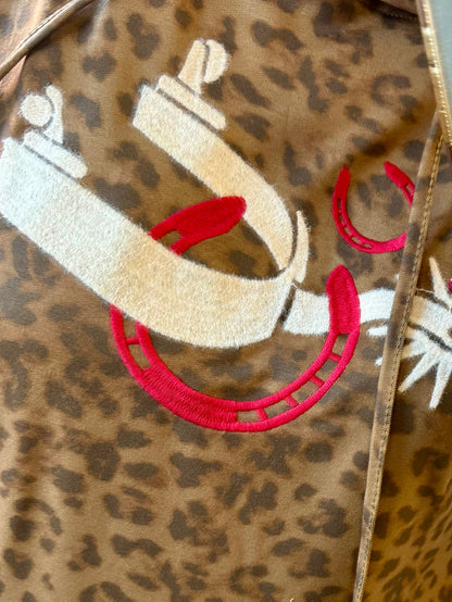 Leopard print hoodie with red and white spur emblem on the front