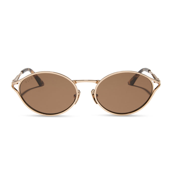 jessie james decker x diff eyewear featuring the limoncello oval sunglasses with a gold frame and brown lenses front view