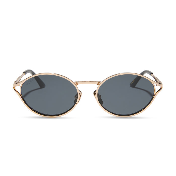 jessie james decker x diff eyewear featuring the limoncello oval sunglasses with a gold frame and grey lenses front view