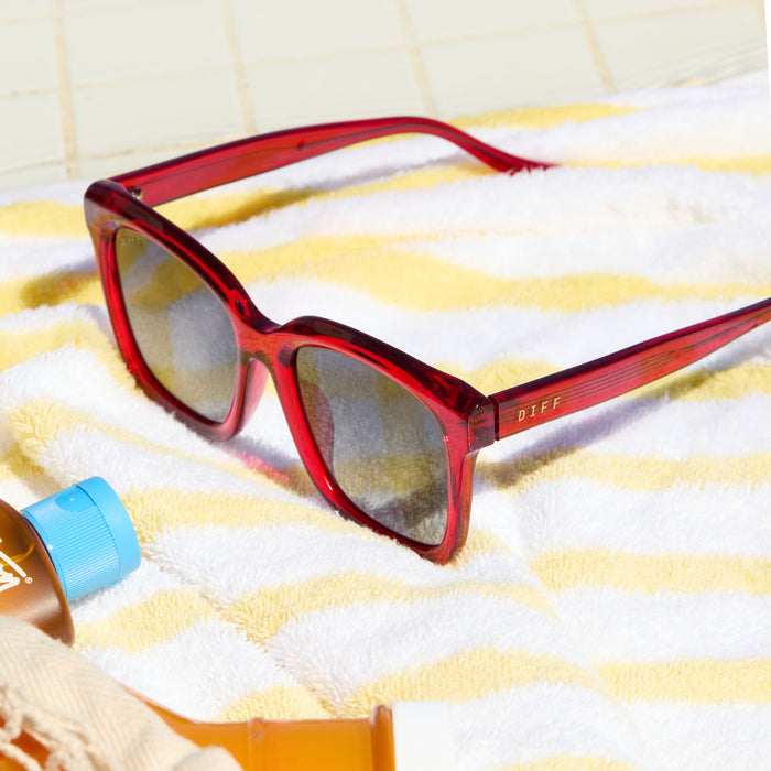 lifestyle - still life of diff eyewear meredith square sunglasses in red hot summer
