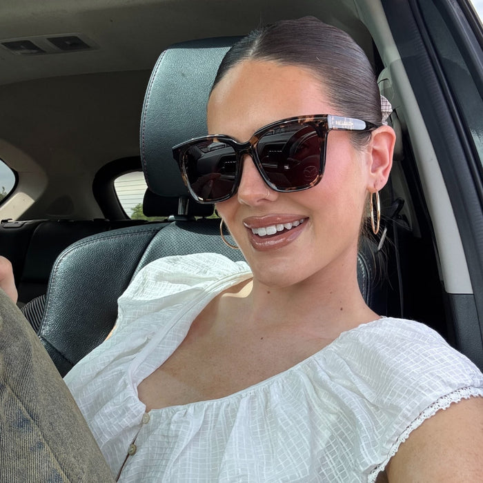 lifestyle - abigail gherring wearing brown tort square sunglasses