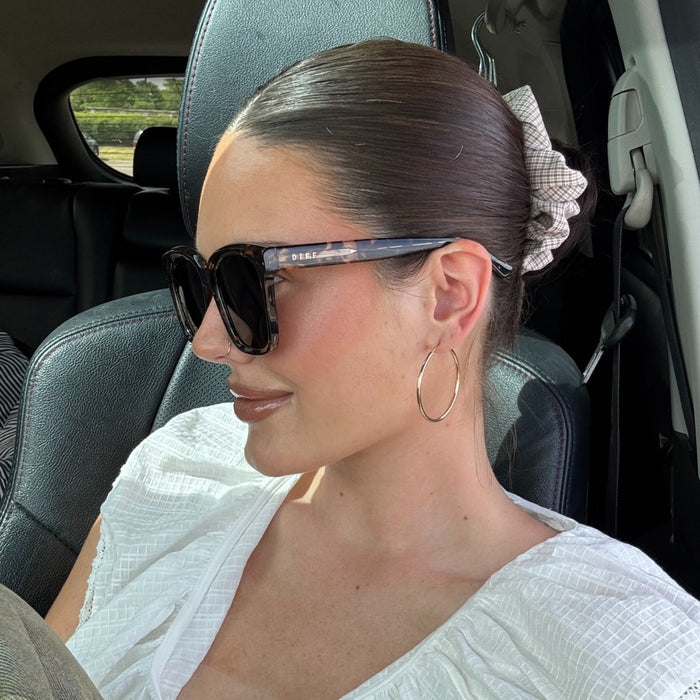 lifestyle - abigail gherring wearing brown tort square sunglasses