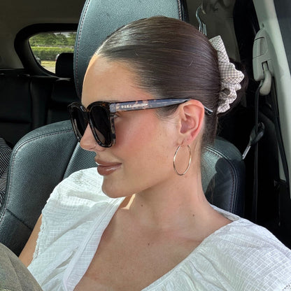 lifestyle - abigail gherring wearing brown tort square sunglasses