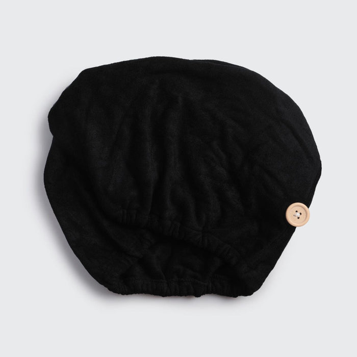 Black Microfiber Hair Towel laid flat showing its shape and fastening detail.