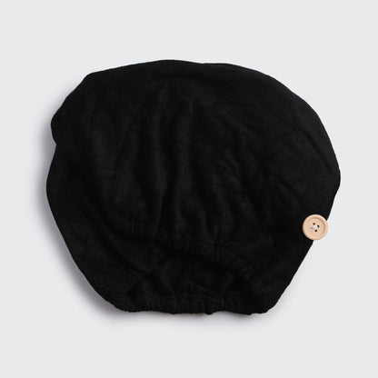 Black Microfiber Hair Towel laid flat showing its shape and fastening detail.