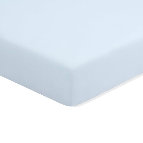 Mini Crib Sheet in Breeze shown on a mattress