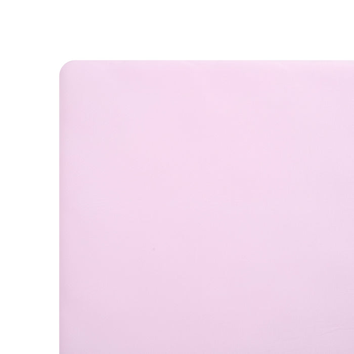 Solid light purple mini crib sheet on mattress