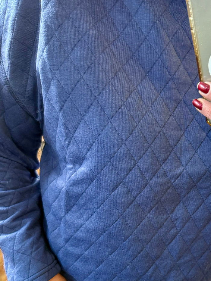 Blue quilted diamond pattern on crewneck sweatshirt front