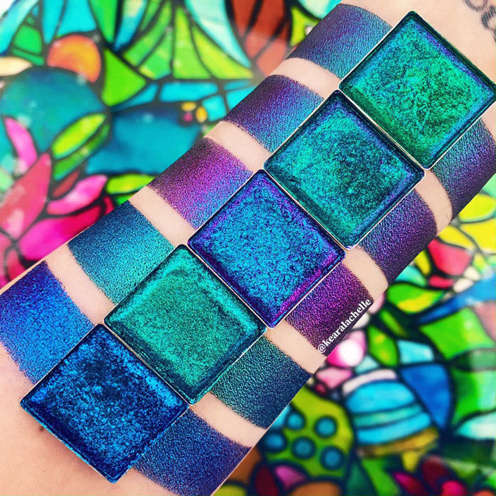 Top angled Anneal Jewelled Multichrome Eyeshadow overtop arm swatches on fair skin tone compared to Anneal, Crown Glass, Castle, Lunette