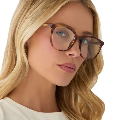 on model - female wearing diff eyewear featuring the parker square prescription glasses with a brown fleur frame angled view