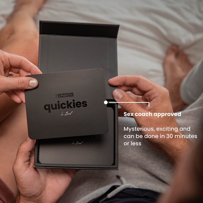 Couple discovering a new card and about to read a Quickies adventure card together, excited to discover their next spontaneous challenge.