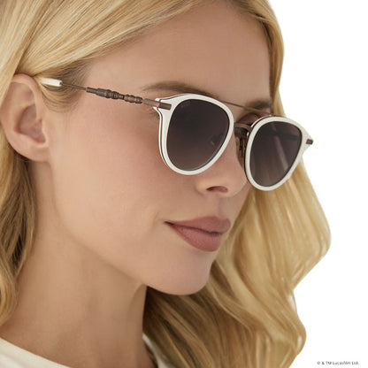 on model - female wearing star wars x diff eyewear featuring the rey™ round sunglasses with a off white + bronze frame and brown gradient polarized lenses side view of light saber temple