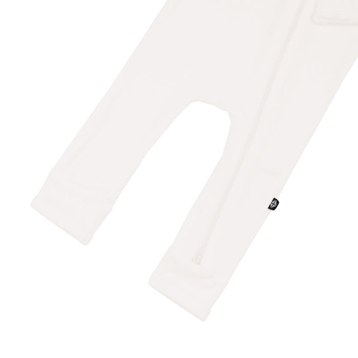 Open feet on Kyte Baby Ribbed Zippered Romper in Cloud