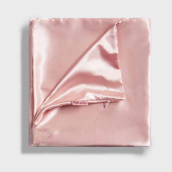 Close-up of Blush satin fabric showing its smooth, silky finish