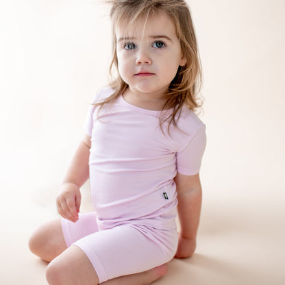 Young girl wearing a light purple pajama set