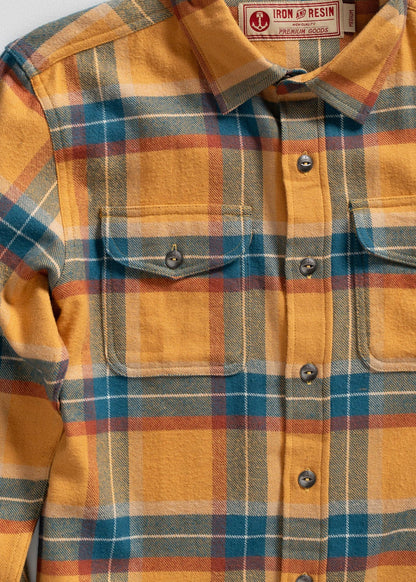 Yellow, blue, and red plaid flannel shirt with buttoned pockets, labeled "Iron and Resin Premium Goods," medium size.