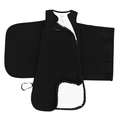 Zipper garage, double zipper and adjustable velcro shown on an unswaddled Sleep Bag Swaddler in Midnight 1.0