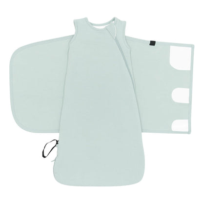 Sleep Bag Swaddler in Sage 1.0 shown unswaddled with the velcro closures visible
