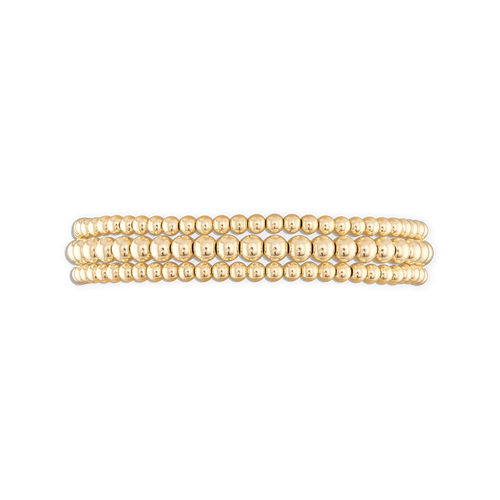 A stack of three gold-colored ball bracelets with an elastic stretch band.