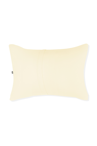 Yellow pillow with envelope closure on a white background