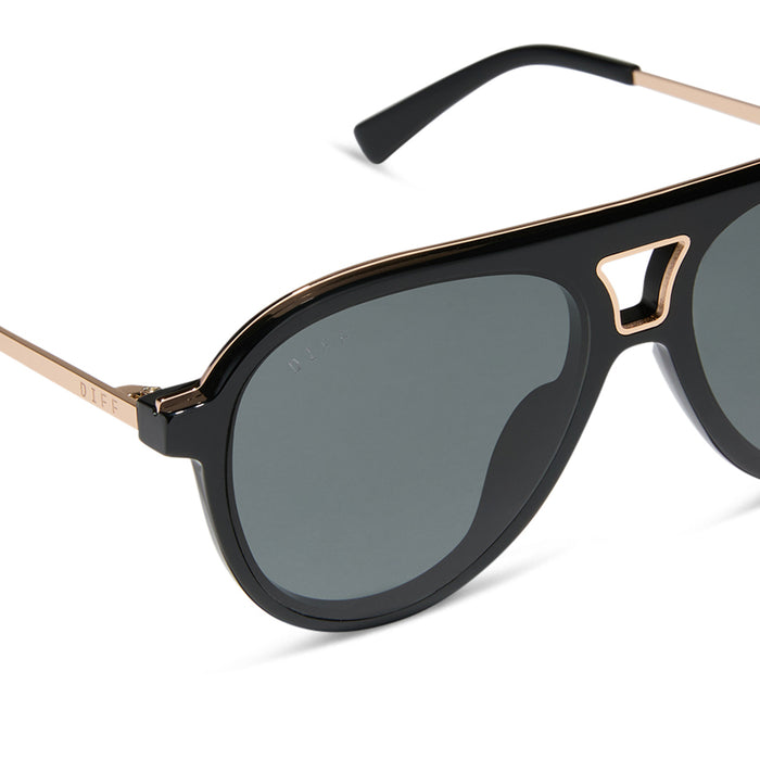 diff eyewear featuring the tosca iii aviator sunglasses with a black frame with gold rim and grey polarized lenses detailed view