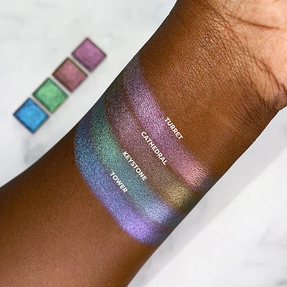Top angled arm swatches on deep skin tone of Turret Pastel Multichrome compared to Cathedral, Keystone, Tower