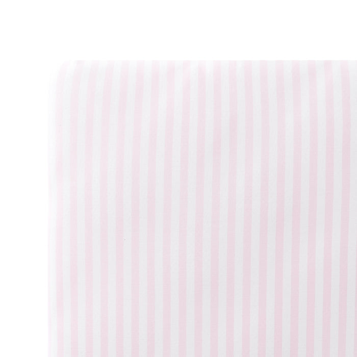 Close up of the Twin Sheet in Small Sakura Stripe shown on a mattress