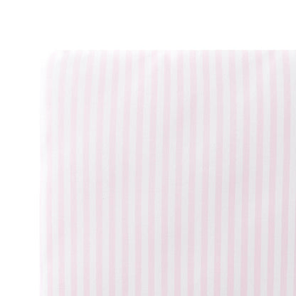 Close up of the Twin Sheet in Small Sakura Stripe shown on a mattress