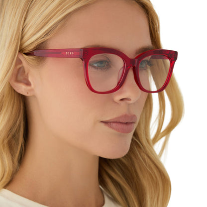 on model - blonde female wearing diff eyewear featuring the winston square prescription glasses with a red hot summer frame angled view